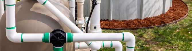 Pool pump and filter system reconnected in spring to restart filtration before swimming.